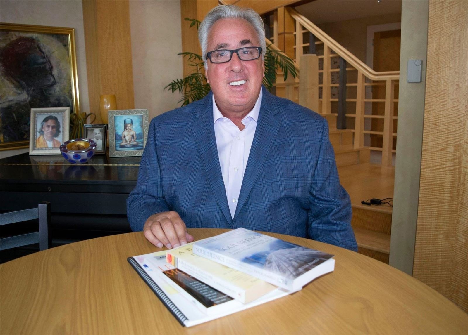 Dr. Peter Amato at a table with copies of his books, Soul Silence and A Blessing in Disguise
